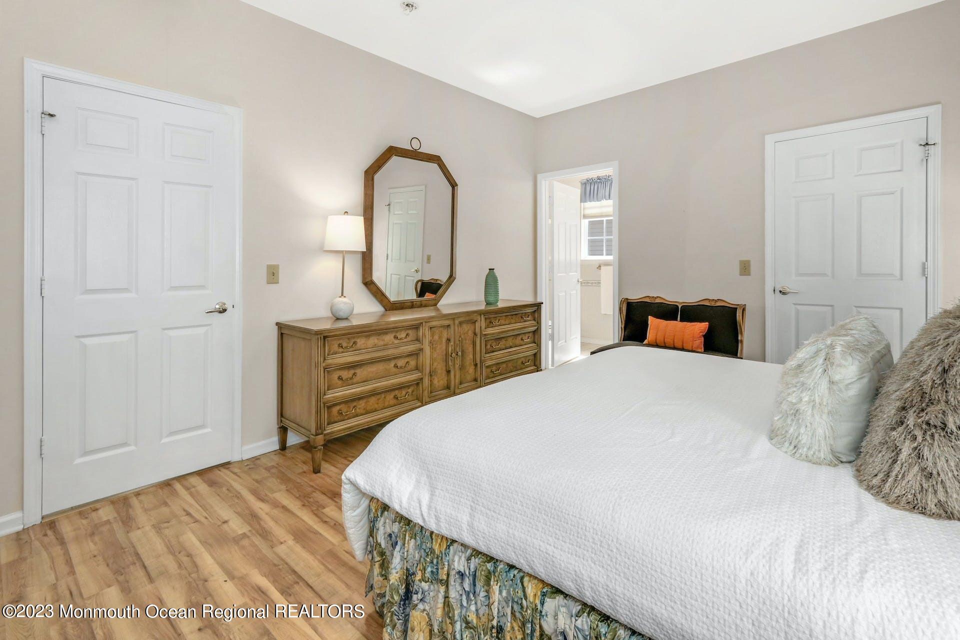 54 Sandpiper Road Barnegat, NJ 08005 - Photo 19 of 27 a bedroom with a bed and a dresser