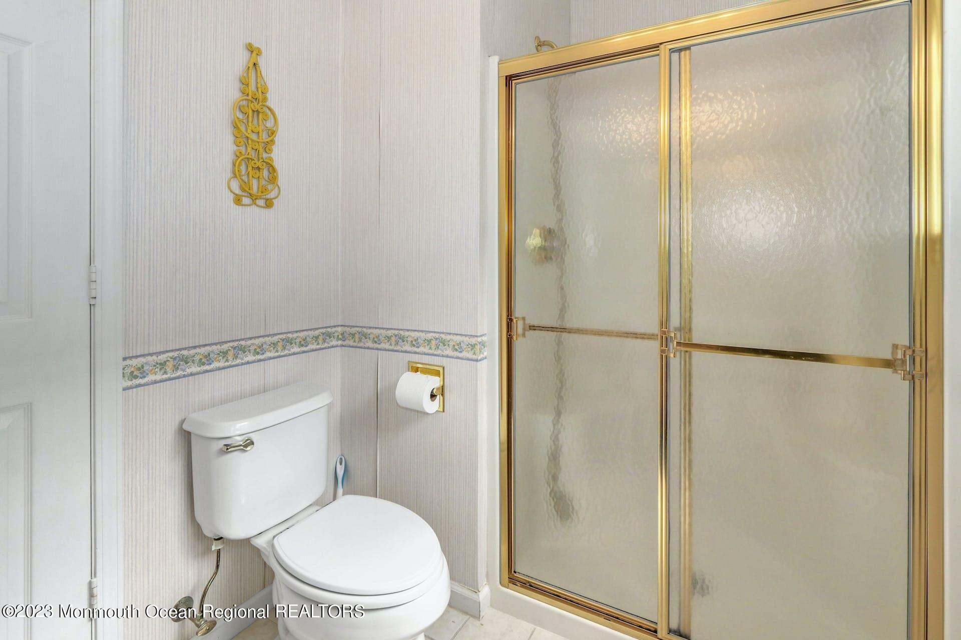 54 Sandpiper Road Barnegat, NJ 08005 - Photo 21 of 27 a bathroom with a toilet and a shower