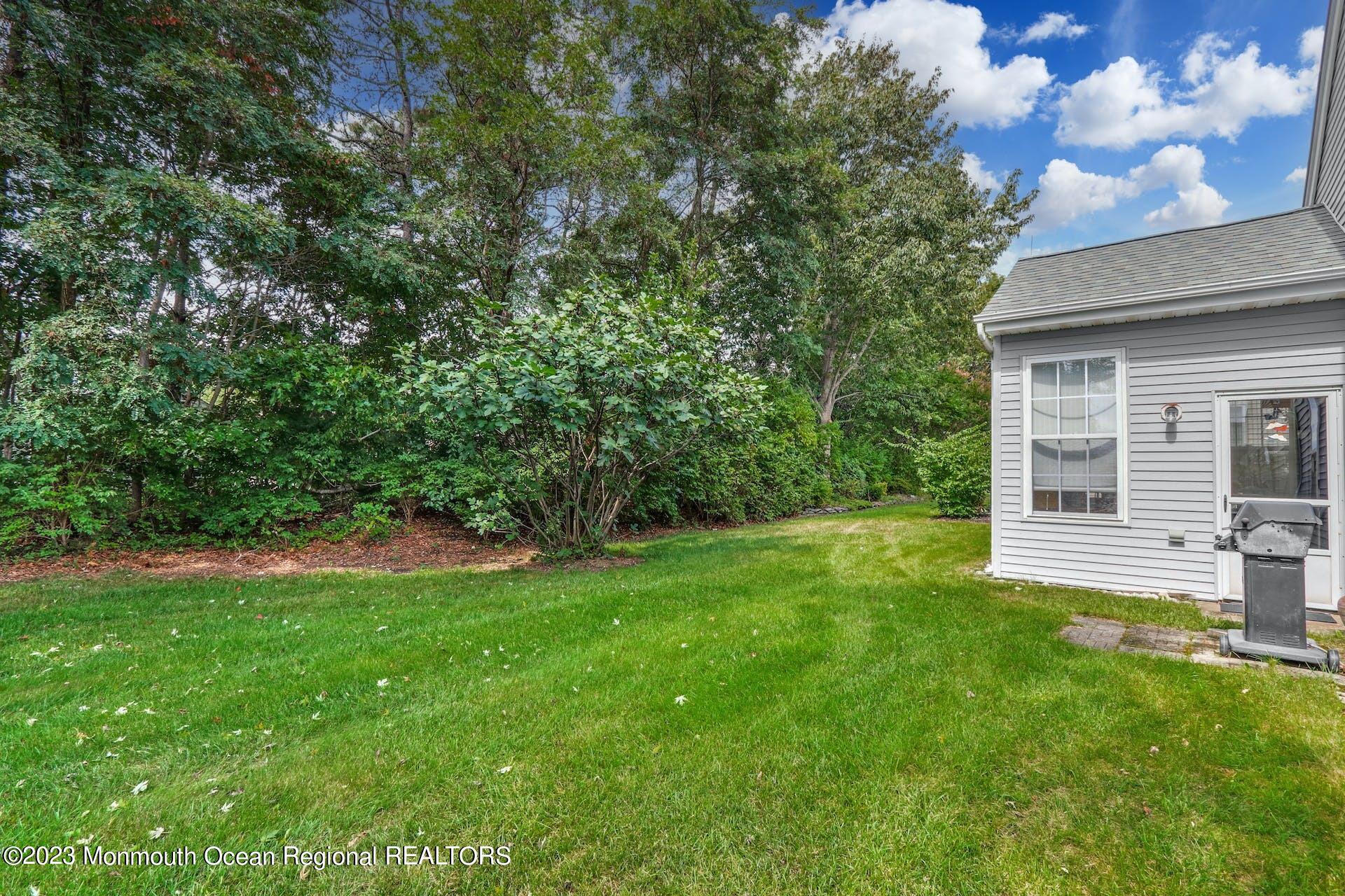 54 Sandpiper Road Barnegat, NJ 08005 - Photo 27 of 27 a view of a house with a backyard
