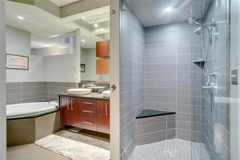 2600 West 7th Street, Unit 1807 Fort Worth, TX 76107 - Photo 15 of 27 a bathroom with a sink a toilet a mirror and shower