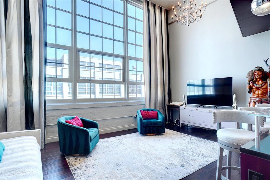 2600 West 7th Street, Unit 1807 Fort Worth, TX 76107 - Photo 2 of 27 a living room with furniture and a flat screen tv