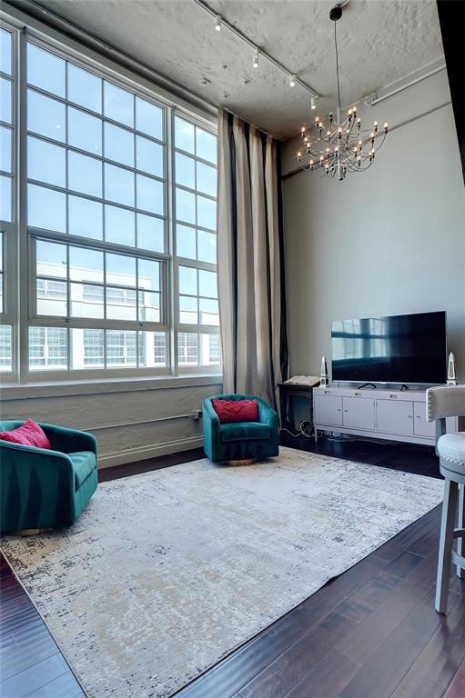 2600 West 7th Street, Unit 1807 Fort Worth, TX 76107 - Photo 6 of 27 a living room with furniture and a chandelier