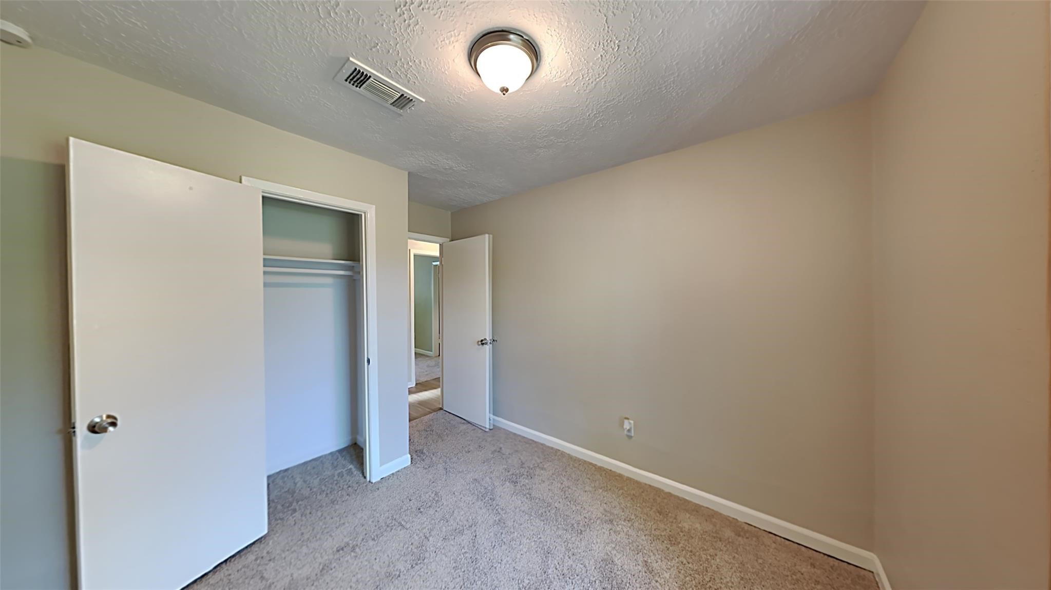 6706 Castleview Lane Houston, TX 77489 - Photo 13 of 17 an empty room with an entryway and shower