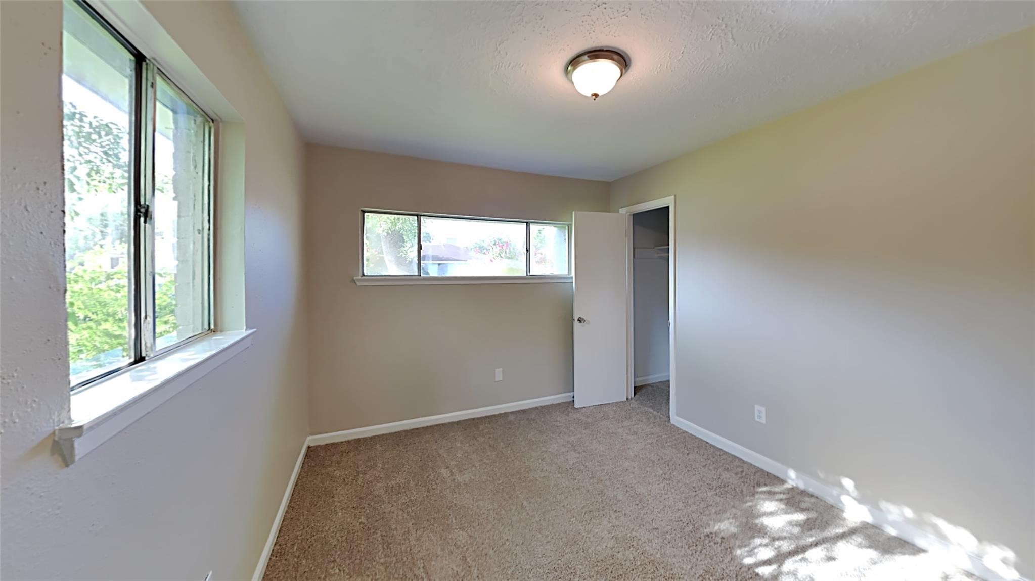 6706 Castleview Lane Houston, TX 77489 - Photo 14 of 17 an empty room with windows