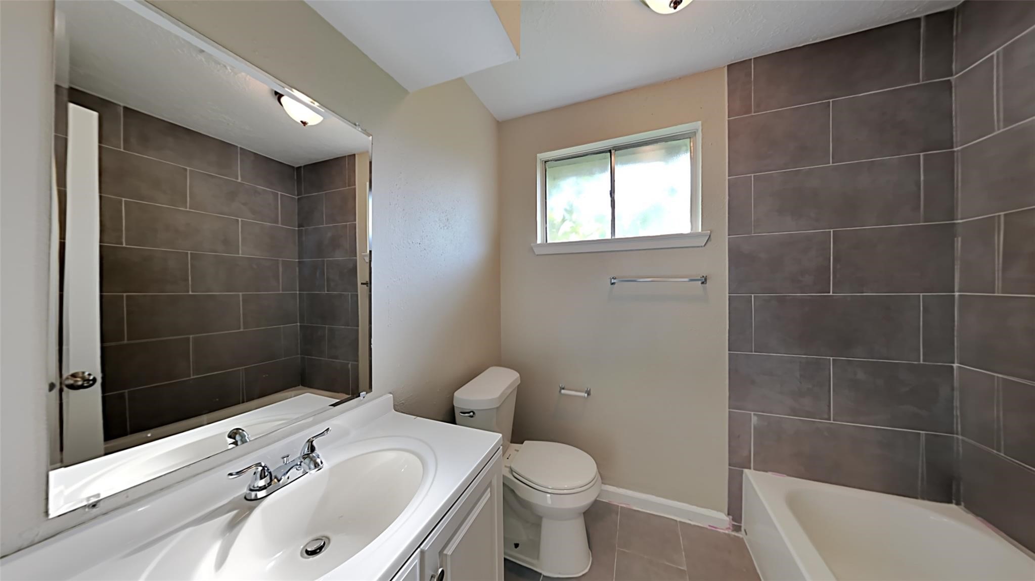 6706 Castleview Lane Houston, TX 77489 - Photo 16 of 17 a bathroom with a sink a toilet and shower