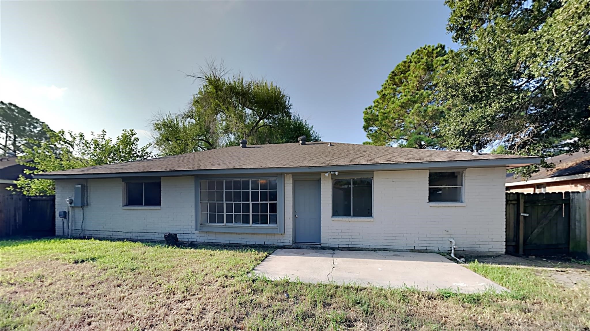 6706 Castleview Lane Houston, TX 77489 - Photo 17 of 17 a house with trees in the background