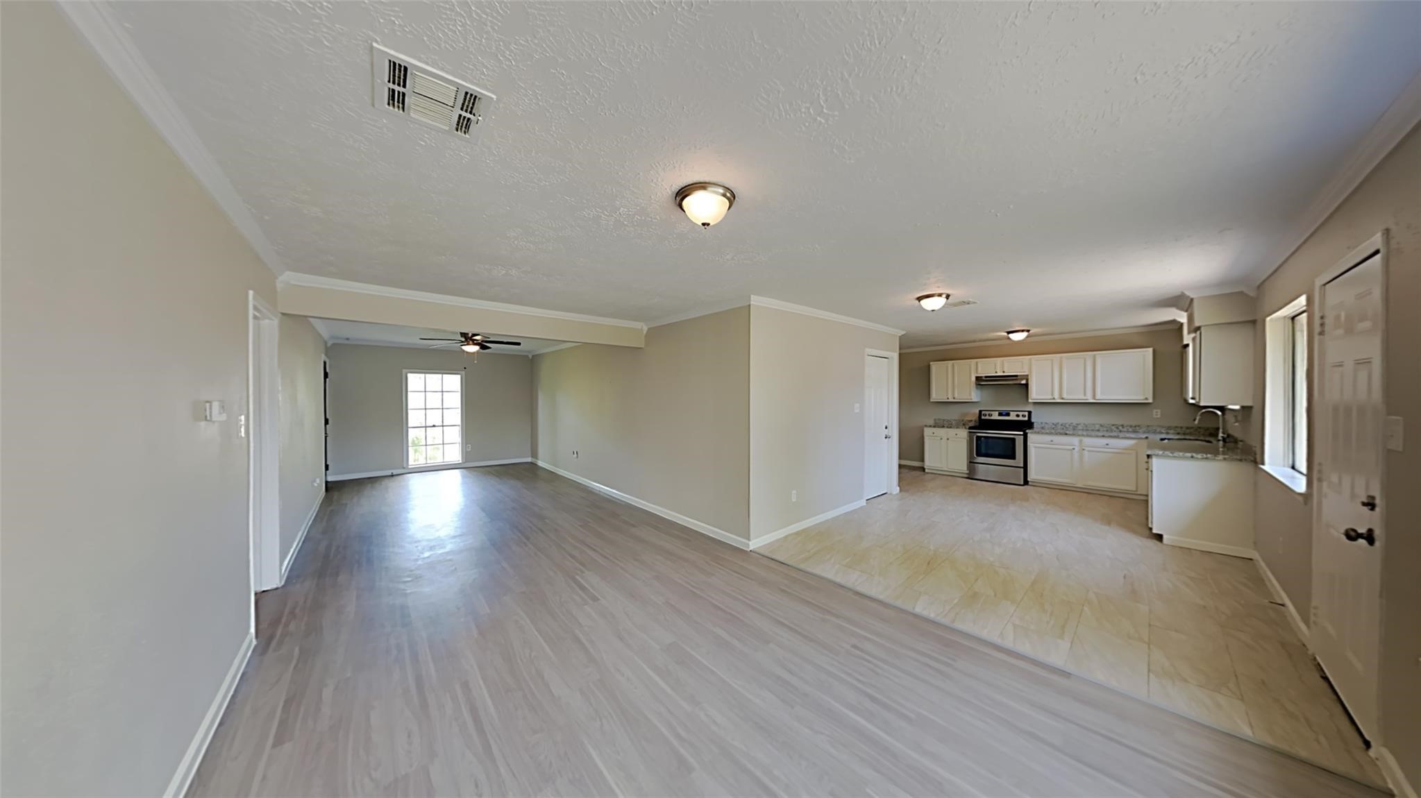 6706 Castleview Lane Houston, TX 77489 - Photo 6 of 17 a view of a kitchen with a sink and a refrigerator