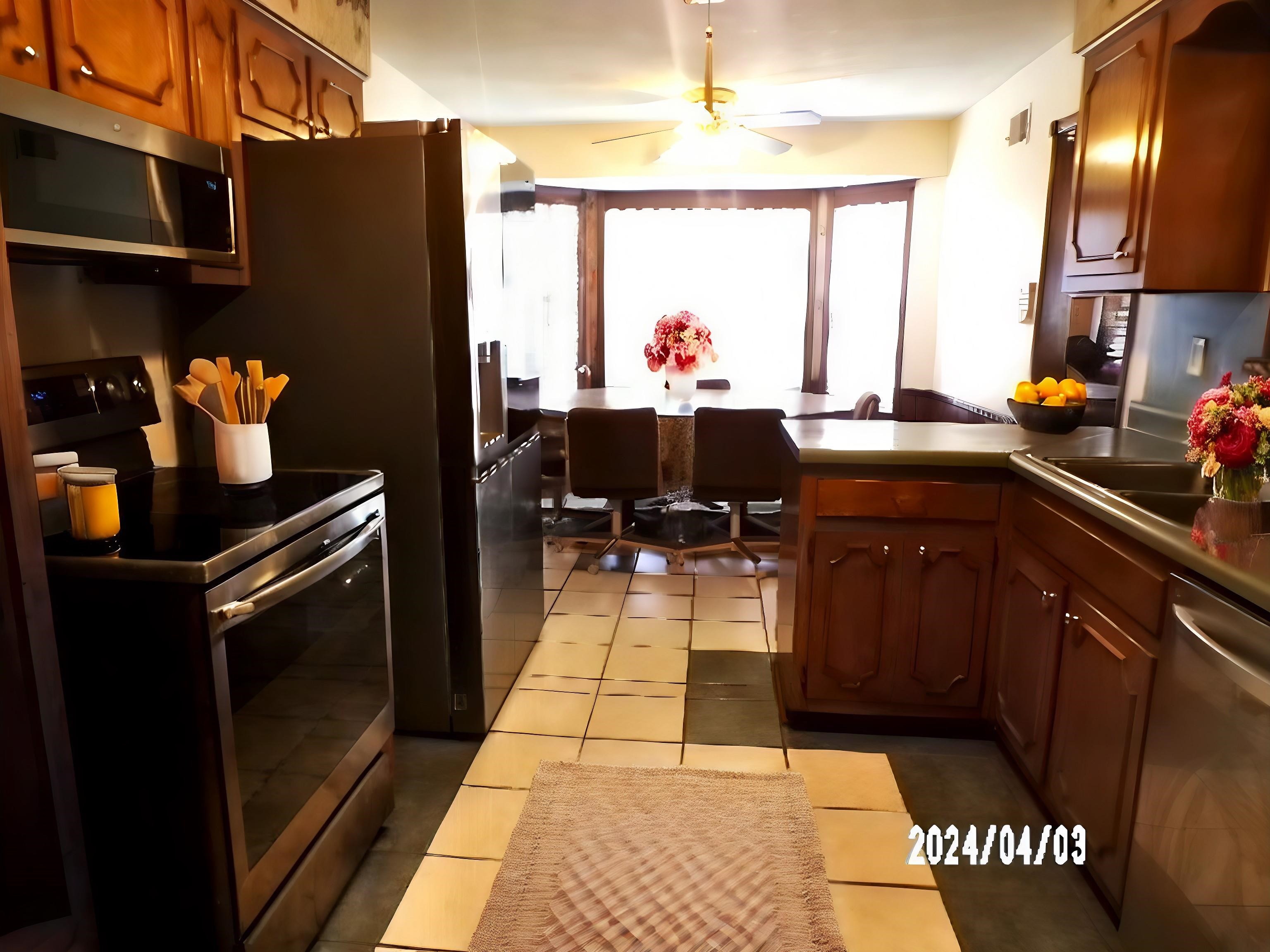 3720 Clarke Road Memphis, TN 38115 - Photo 6 of 29 Kitchen featuring ceiling fan, stainless steel appliances, and light tile floors