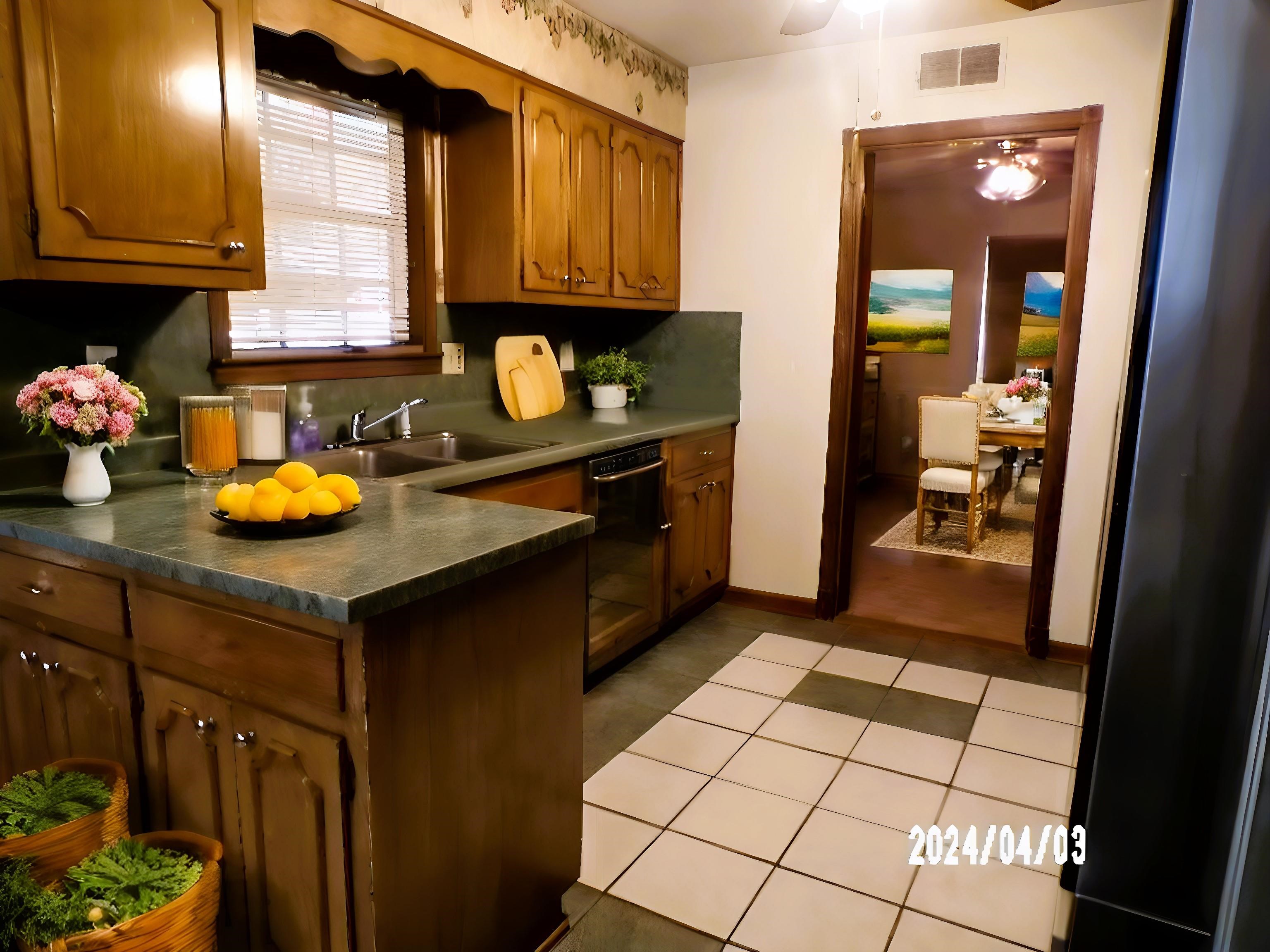 3720 Clarke Road Memphis, TN 38115 - Photo 7 of 29 Kitchen with sink, light tile flooring, and dishwasher
