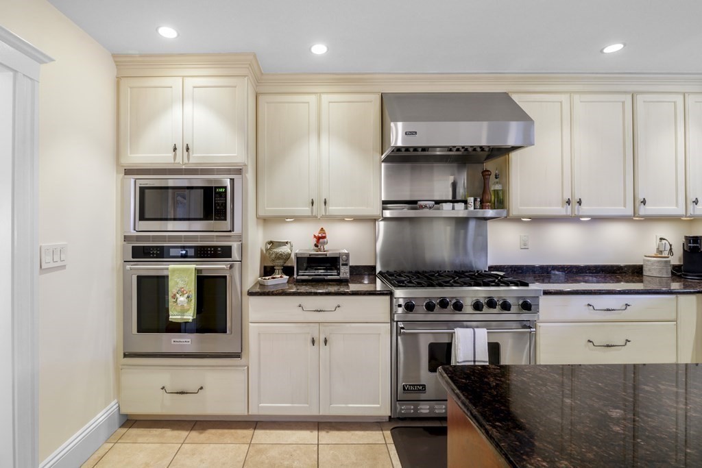 14 Homestead Road Marblehead, MA 01945 - Photo 26 of 41 a kitchen with stainless steel appliances granite countertop a stove a sink and a microwave
