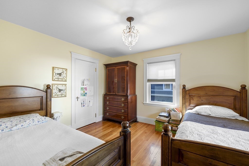 14 Homestead Road Marblehead, MA 01945 - Photo 37 of 41 a bedroom with a bed and wooden floor