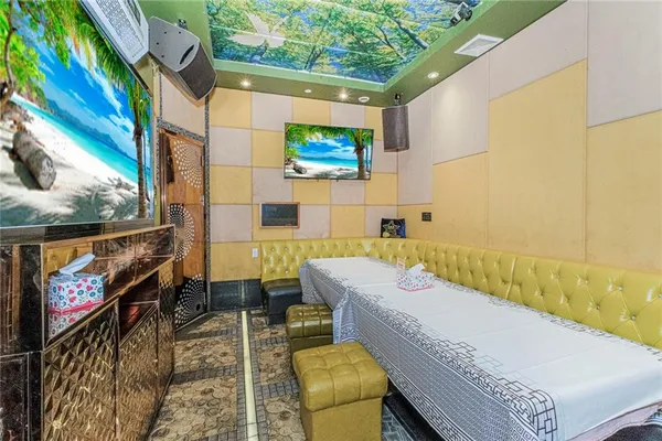 a bathroom with a tub sink and mirror