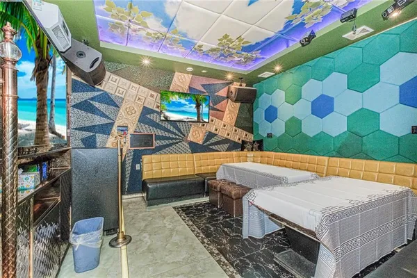 a living room with a couch and a flat screen tv