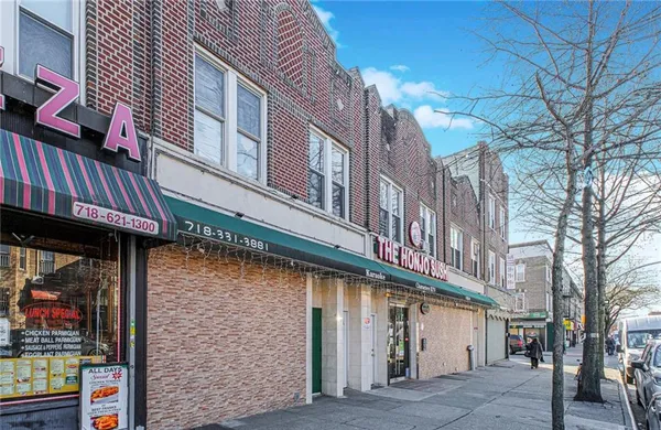 a view of a building with a glass door