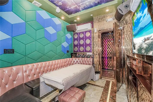 a bathroom with a sink mirror and toilet