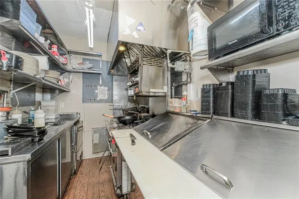 a living room with a table and chairs