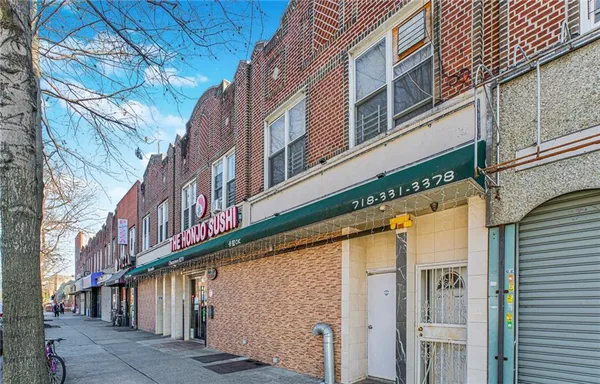a street sign on a large building