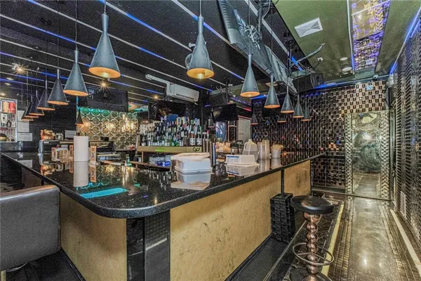 a room with lots of bottles of alcohol