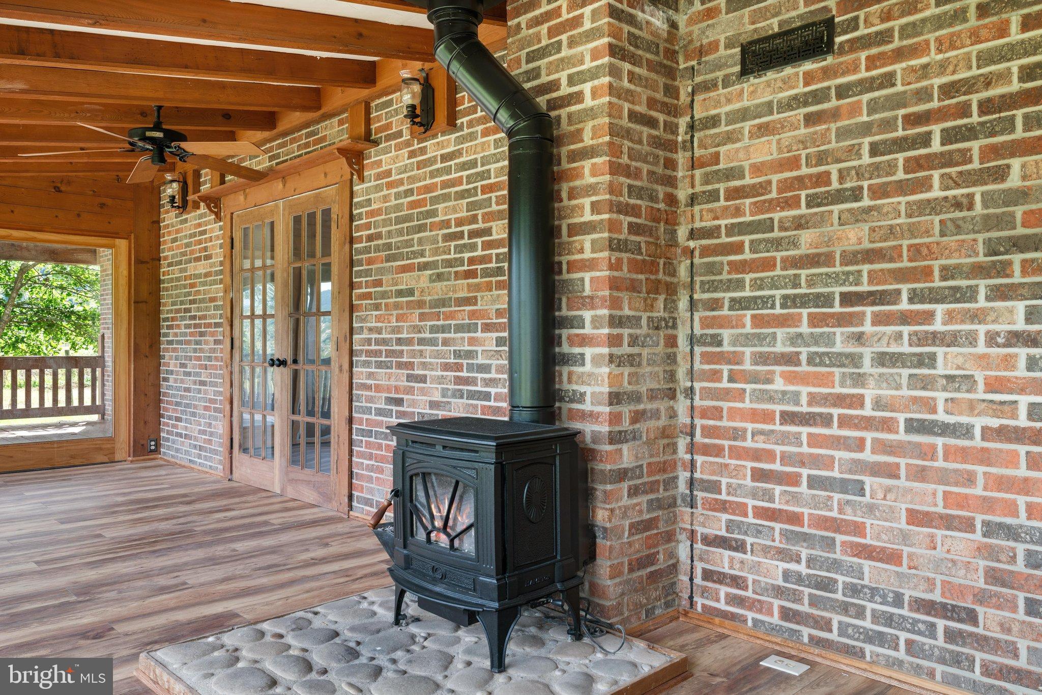 134 Spring Mountain Way Fort Valley, VA 22652 - Photo 31 of 69 Back porch with wondows for year round comfort.