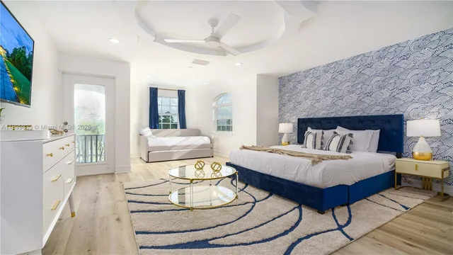 a bedroom with a bed and a chair