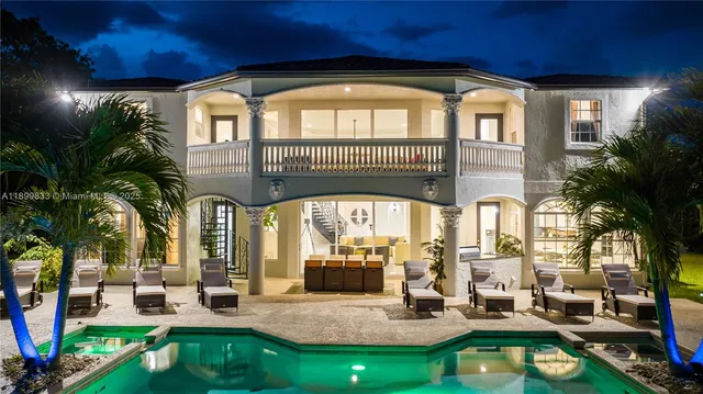 a building outdoor space with patio furniture and potted plants
