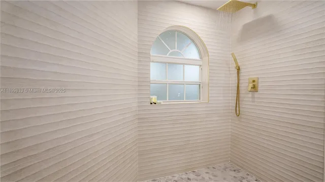 a view of a swimming pool and lounge chairs