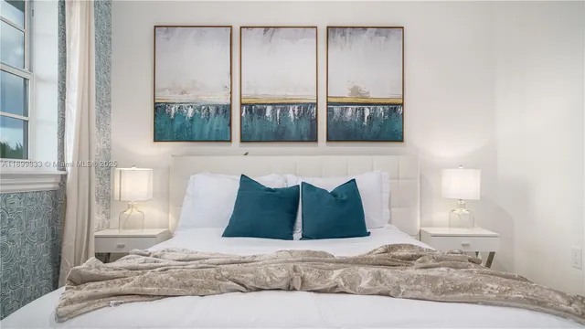 a backyard of a house with lots of green space and lake view