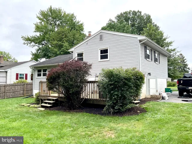 a view of backyard with a garden and entertaining space