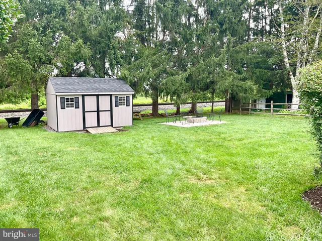a house view with a sitting space and garden