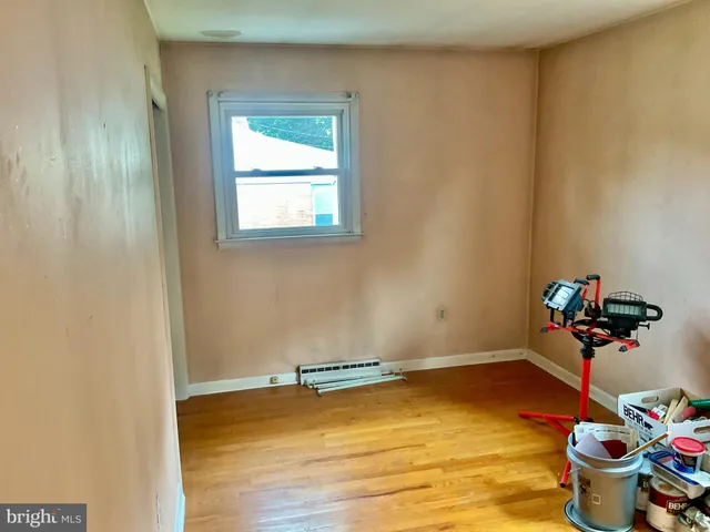 a view of a room with toys and wooden floor