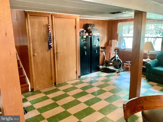 a kitchen with a table and chairs in it