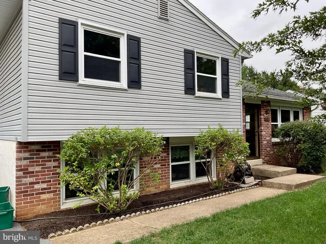 a view of a house with a yard and plants