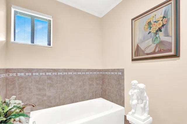 a bathroom with a sink a bathtub and shower