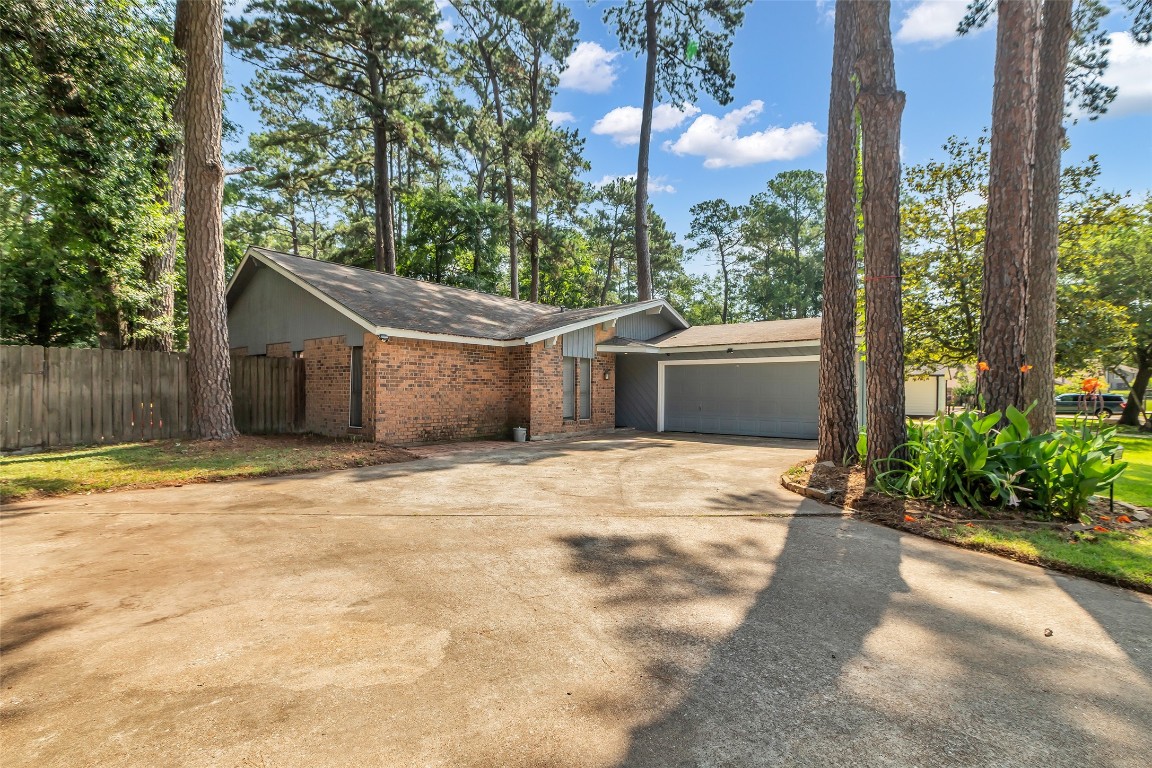 a view of a house with a yard and garage