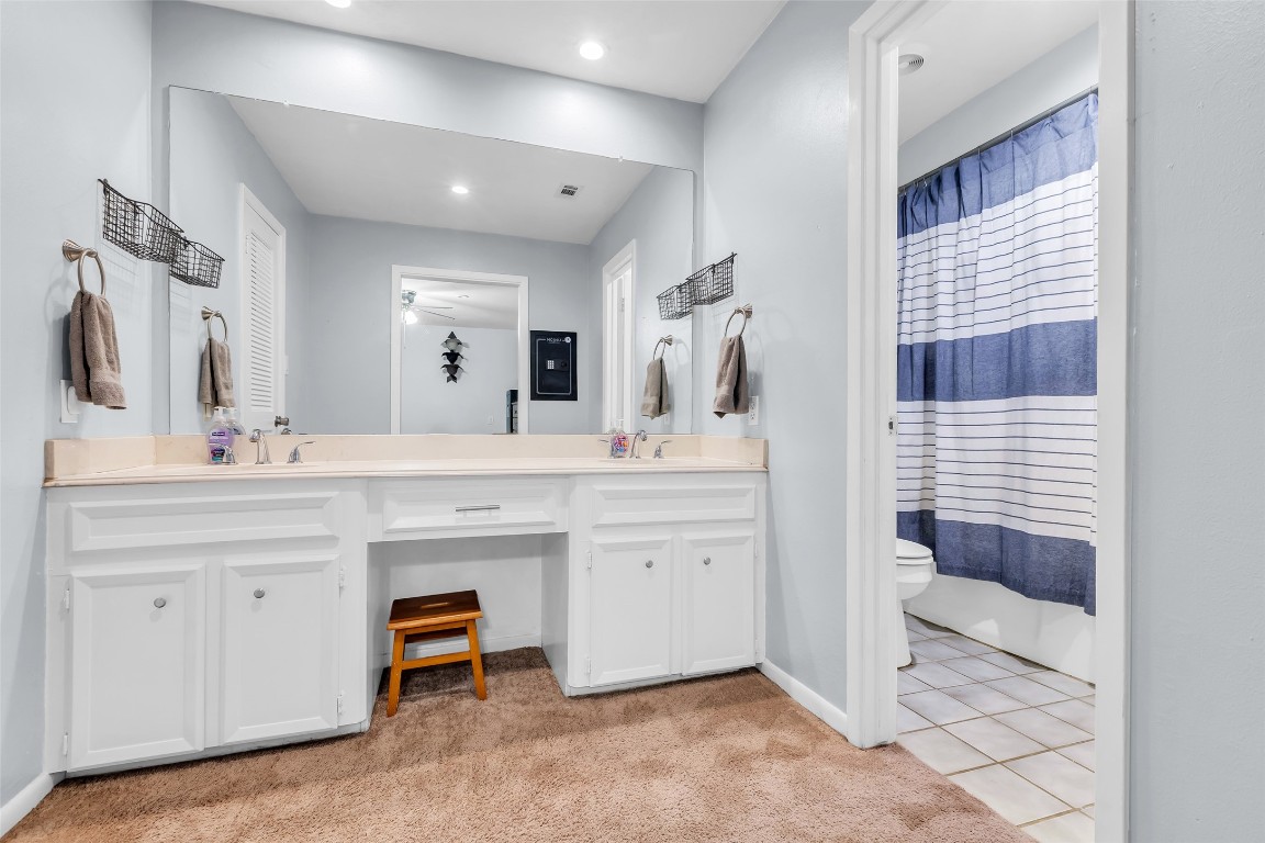 13860 Ventura Road Willis, TX 77318 - Photo 12 of 22 a spacious bathroom with a shower a sink and a mirror