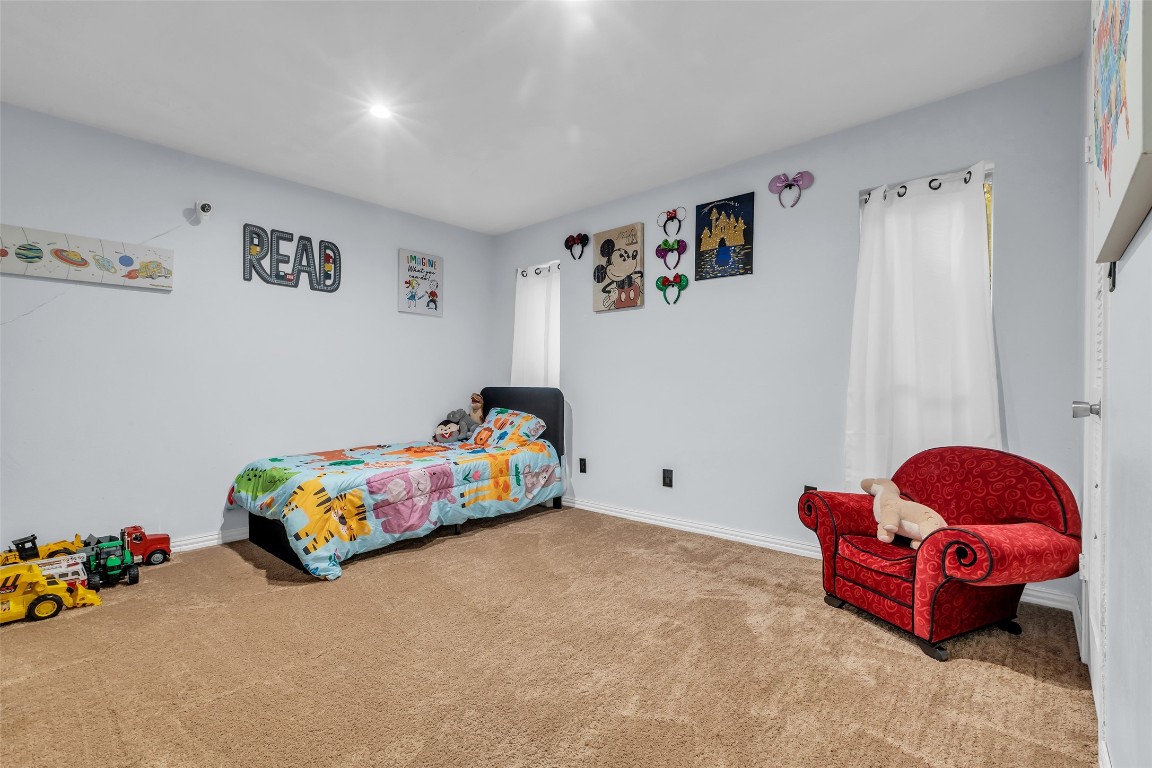 13860 Ventura Road Willis, TX 77318 - Photo 13 of 22 a bedroom with toys and dresser