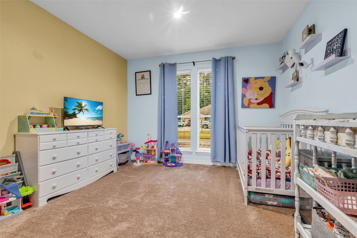 13860 Ventura Road Willis, TX 77318 - Photo 14 of 22 a view of a bedroom with toys