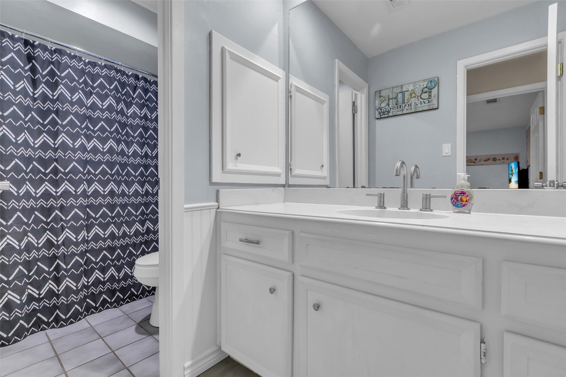 13860 Ventura Road Willis, TX 77318 - Photo 15 of 22 a bathroom with a sink and a mirror
