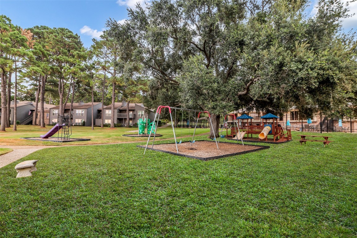 13860 Ventura Road Willis, TX 77318 - Photo 21 of 22 a view of a house with a big yard and sitting area