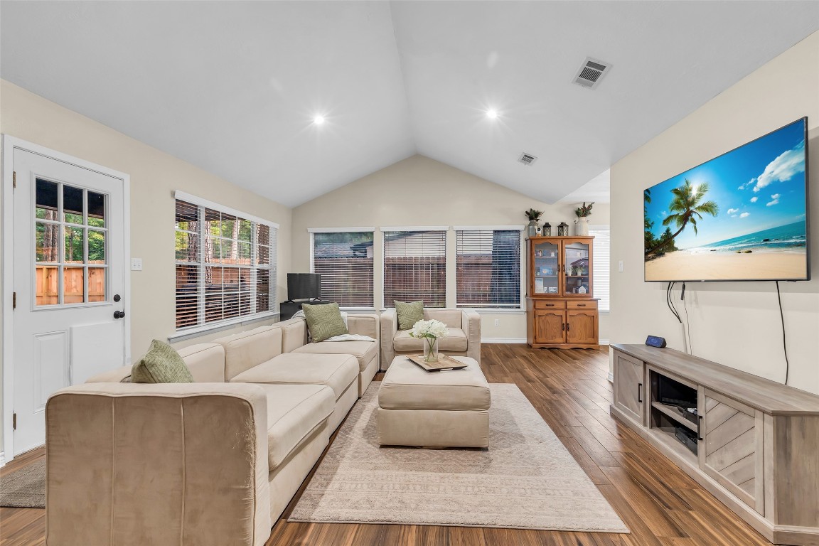 13860 Ventura Road Willis, TX 77318 - Photo 4 of 22 a living room with furniture flat screen tv and a fireplace