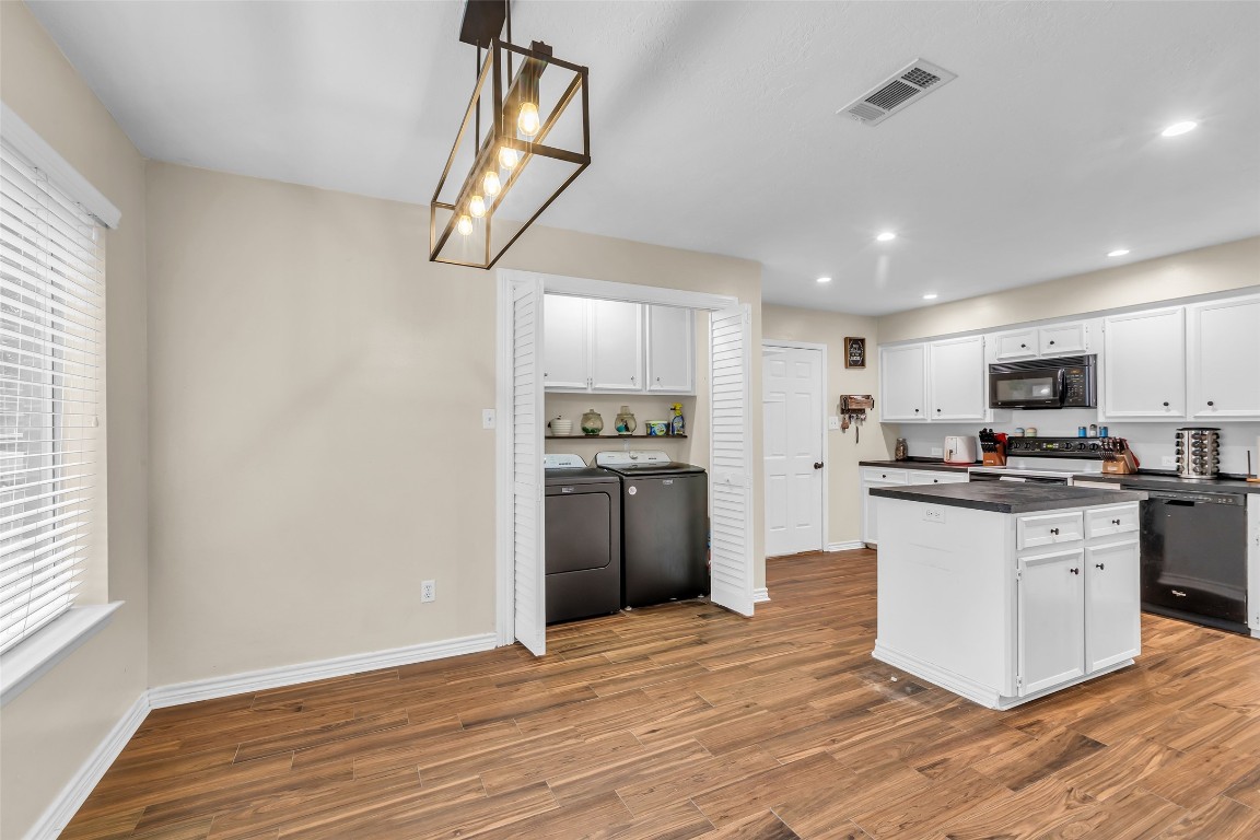 13860 Ventura Road Willis, TX 77318 - Photo 10 of 22 a kitchen with stainless steel appliances granite countertop a refrigerator and a stove top oven
