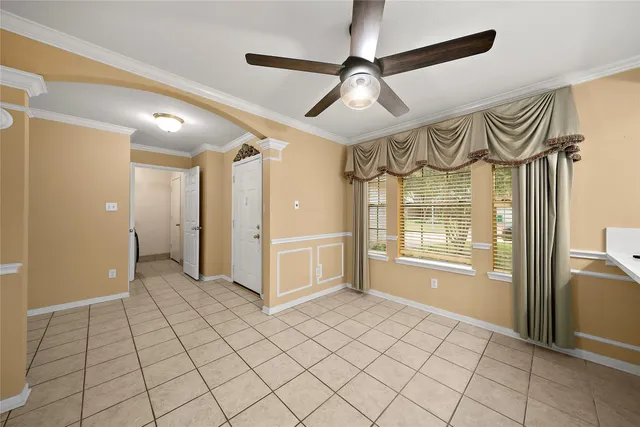 a view of an empty room and a window