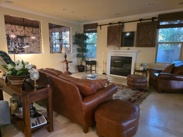 a spacious bedroom with a bed and a couch