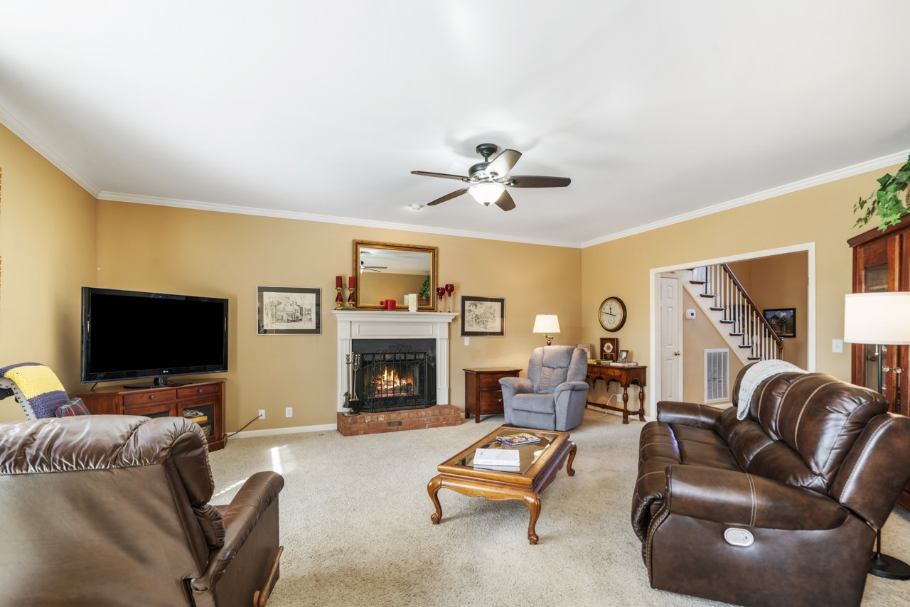 114 Rigby Drive Franklin, TN 37064 - Photo 12 of 55 a living room with furniture flat screen tv and a fireplace