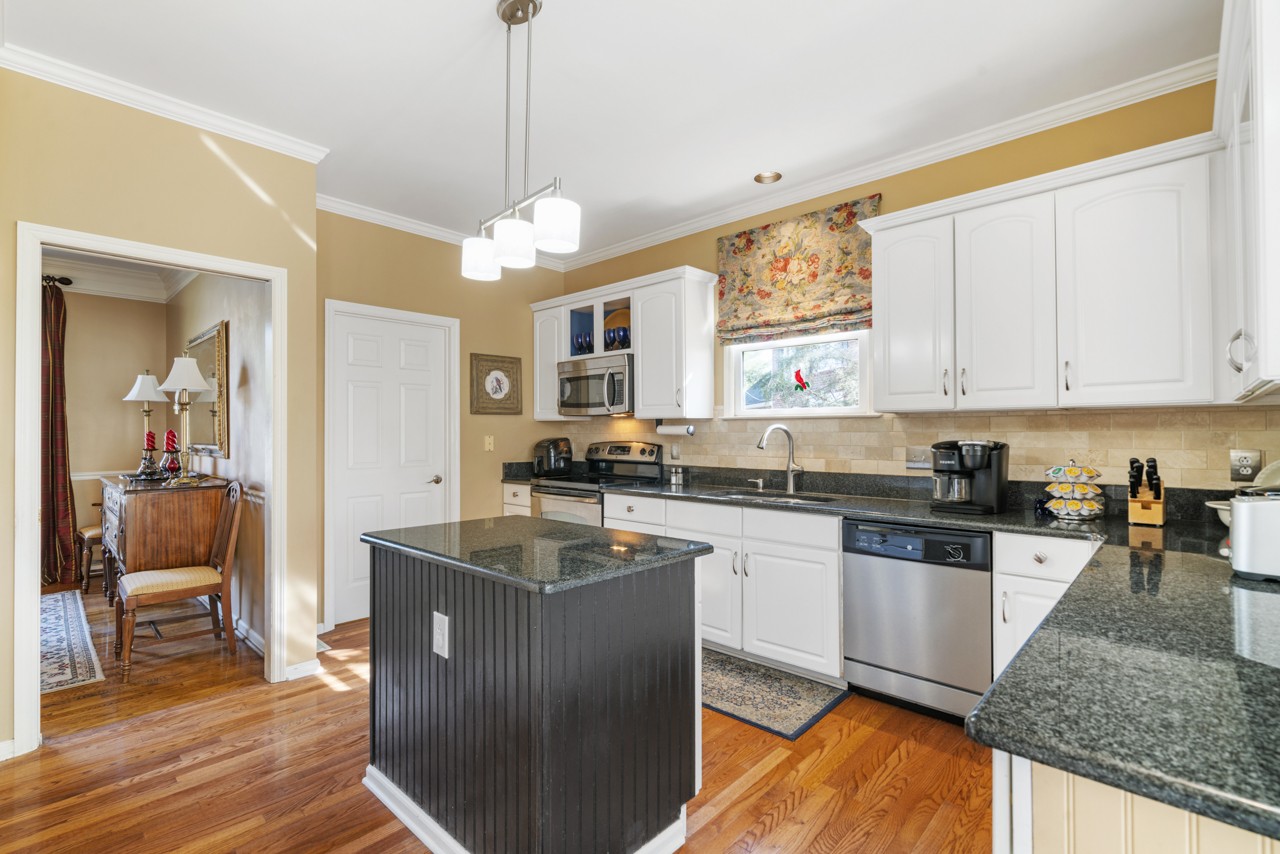 114 Rigby Drive Franklin, TN 37064 - Photo 16 of 55 a kitchen with stainless steel appliances granite countertop a sink stove and refrigerator