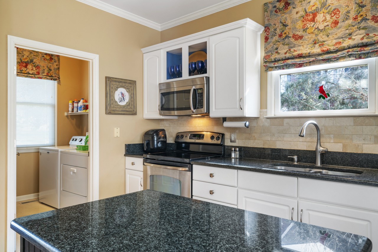 114 Rigby Drive Franklin, TN 37064 - Photo 17 of 55 a kitchen with stainless steel appliances granite countertop a stove a sink and a microwave