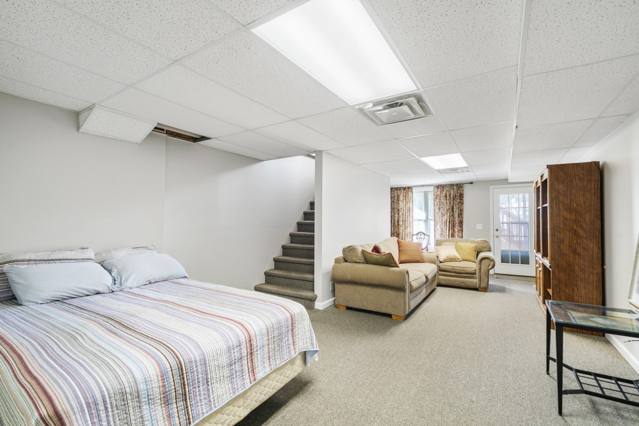 114 Rigby Drive Franklin, TN 37064 - Photo 34 of 55 a spacious bedroom with a bed and a flat screen tv