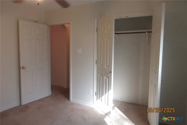 a view of a bathroom from a hallway