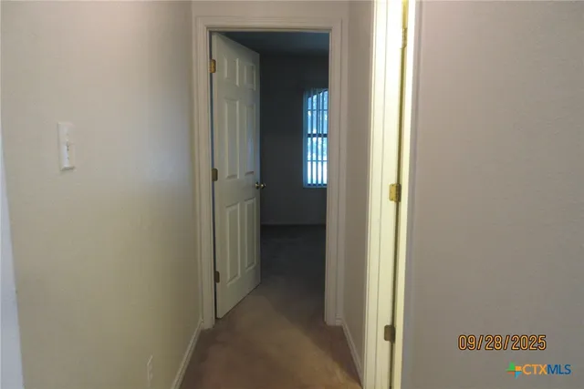 a bathroom with a toilet and shower