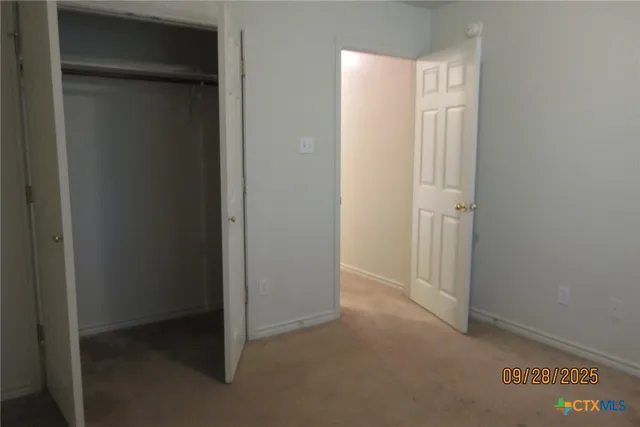 a view of a bathroom from a corridor